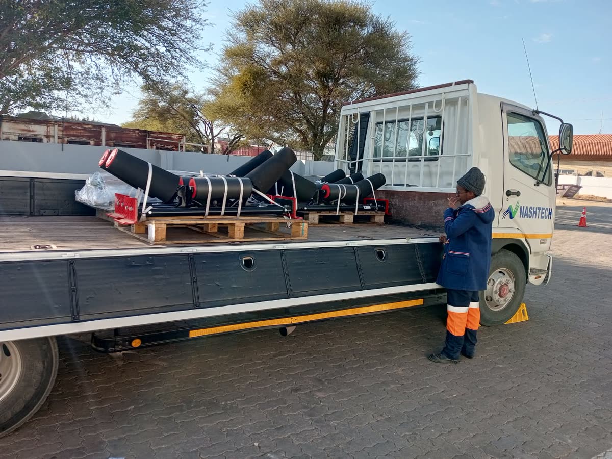 Truck loaded with conveyor idler rollers for delivery