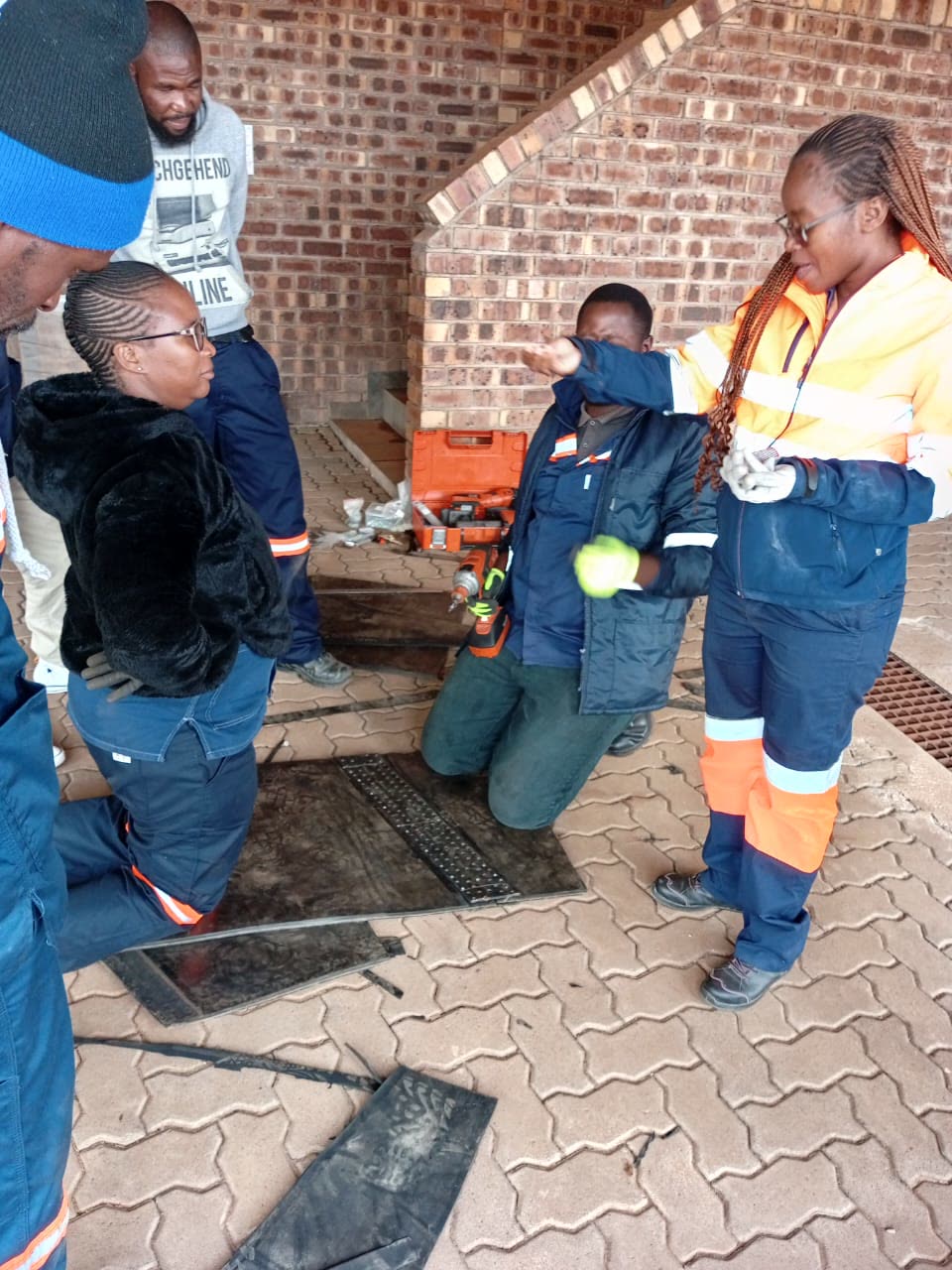Field service team working on a conveyor belt